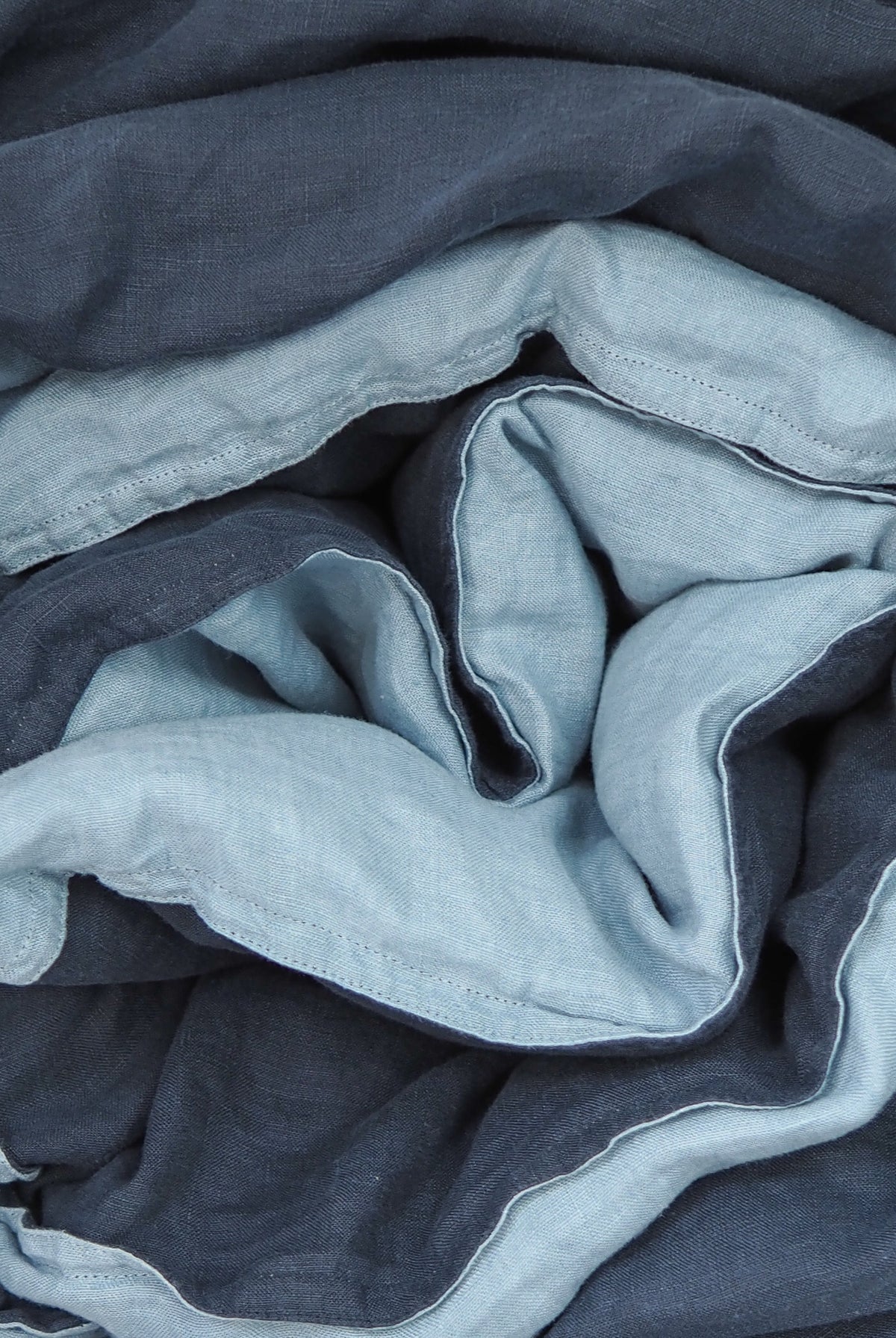 A quilt cover and pillowcase set in navy blue colour with taupe backing