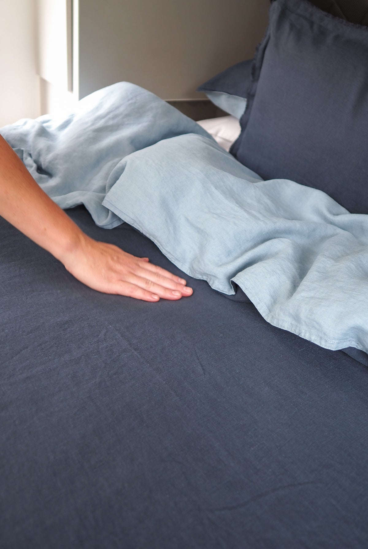 detailed fabric image navy blue and taupe blue with hand stroking the fabric