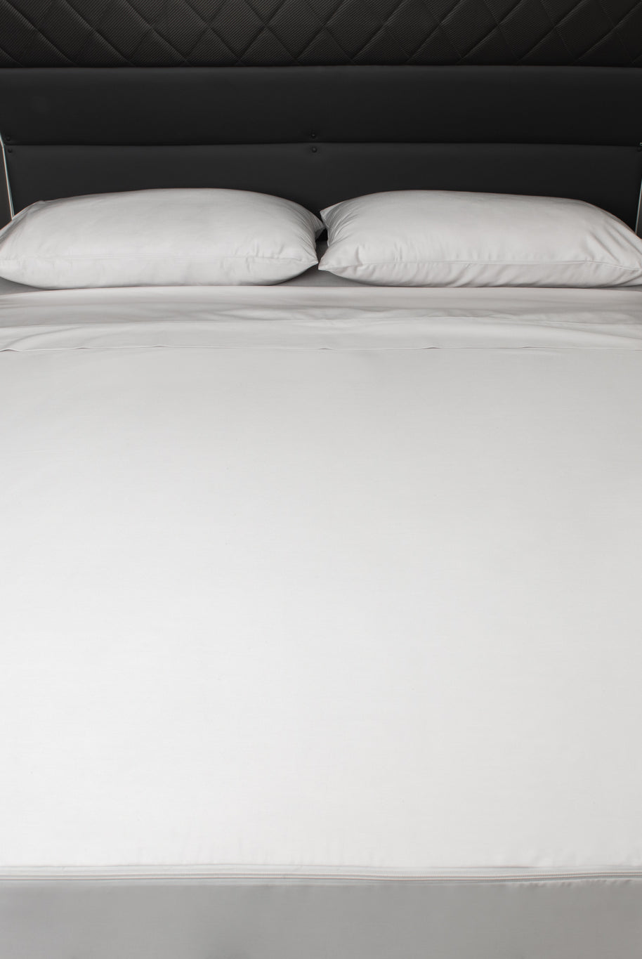 Caravan bed with MeanderWild Driftwood colourway sheet set