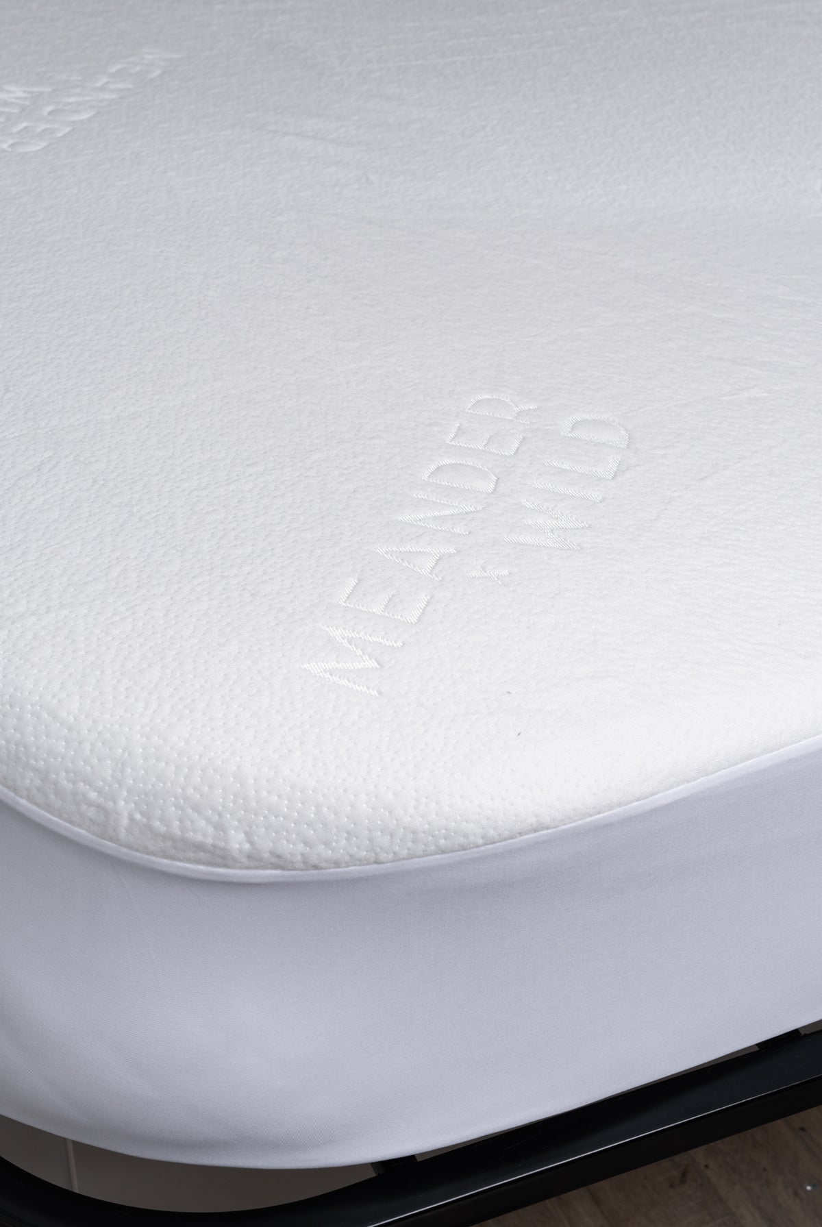 Detail of rounded corner mattress protector