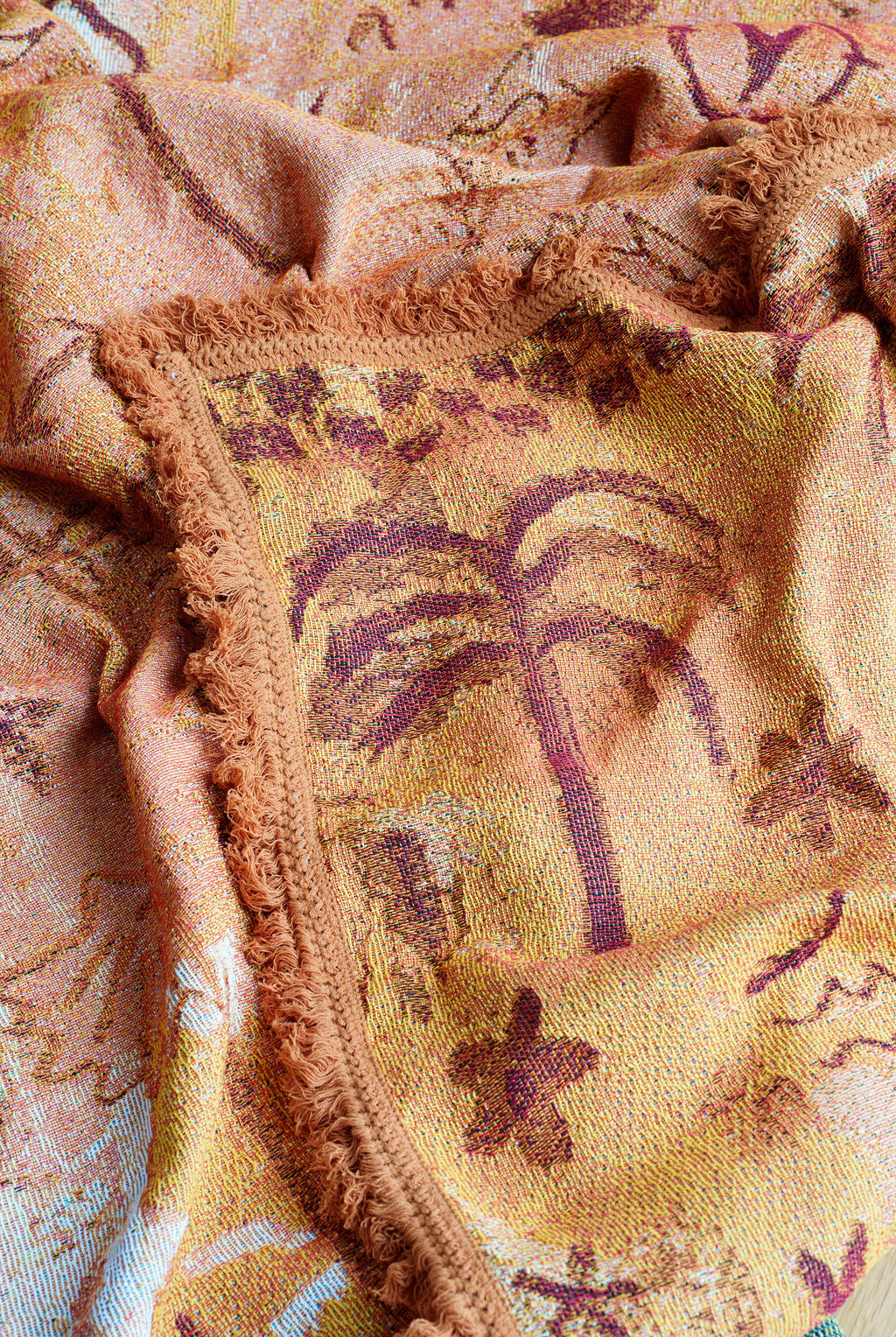 Detail of palm tree on the painted track throw