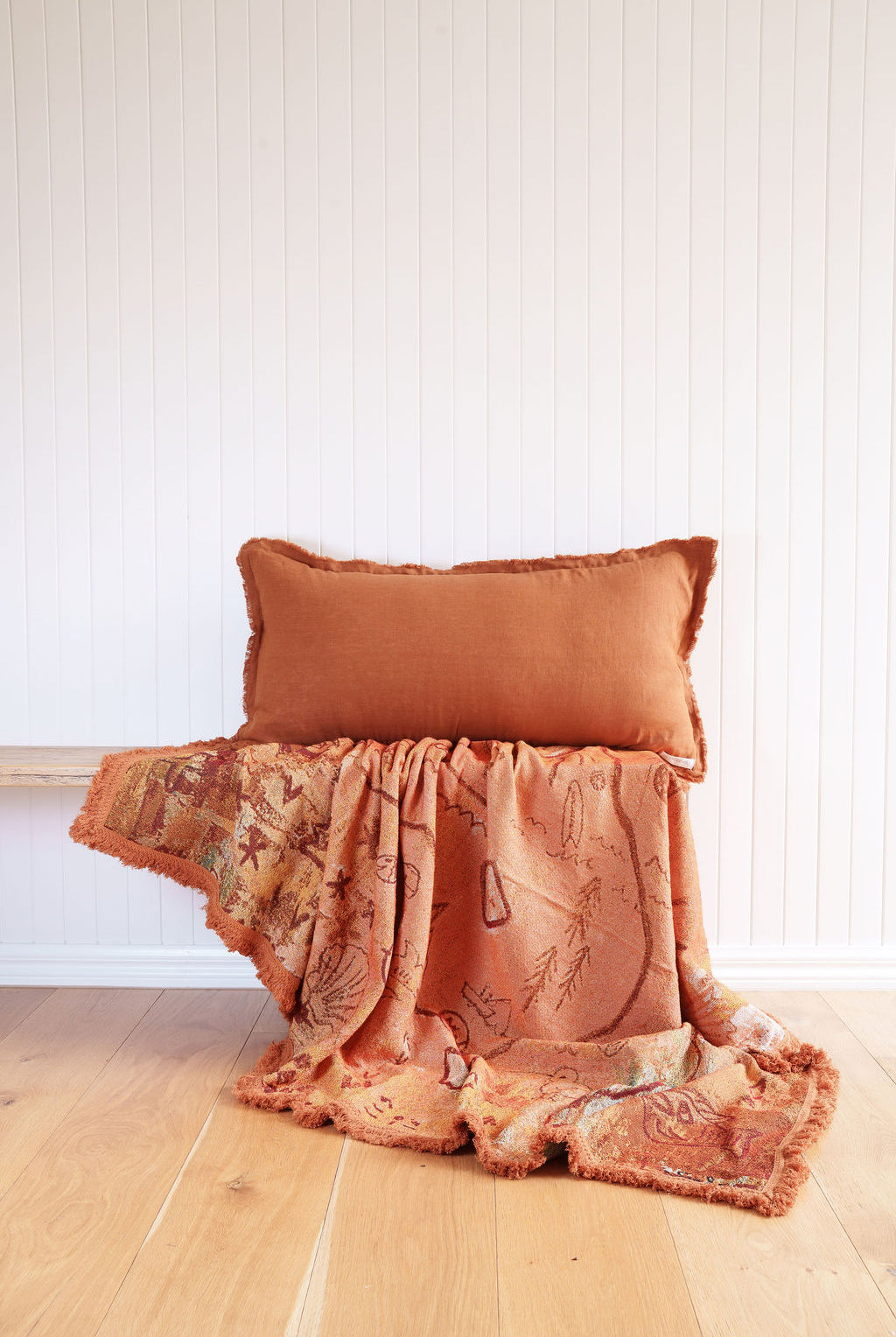 Painted track throw and Ochre Lumbar cushion styled on bench