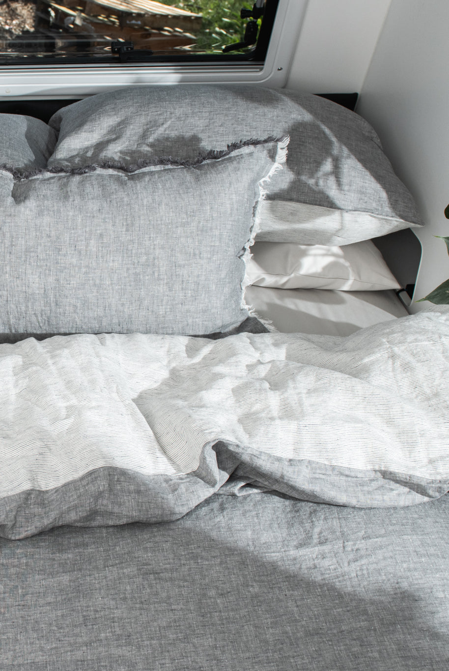 A caravan bed made up in Pier colourway