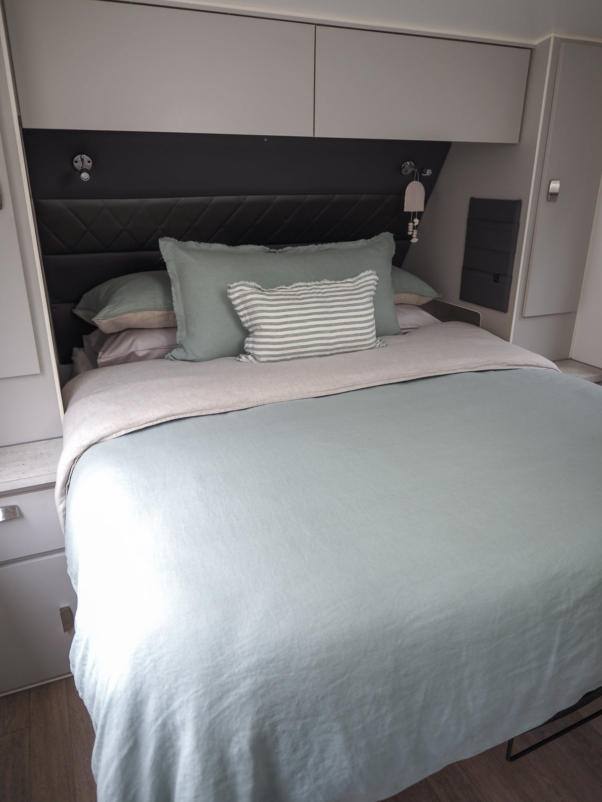 Caravan bed with Seaglass quilt cover and mini stripe cushion