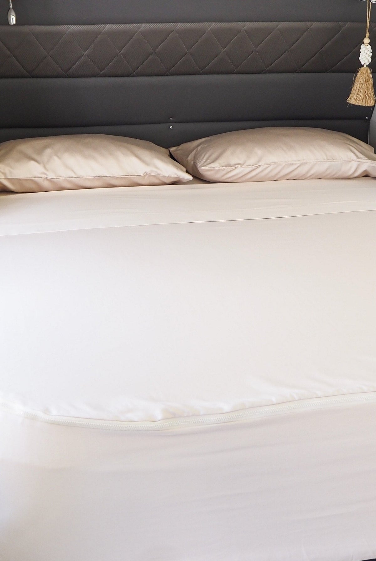 Caravan bed featuring MeanderWild Sheet set in Dune