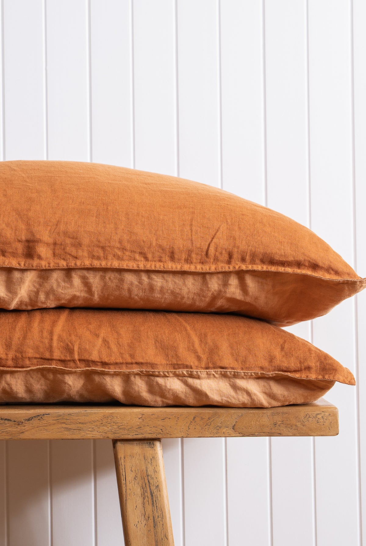 Ochre Pillow stack on white wall