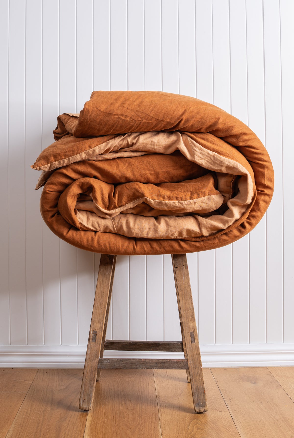 Ochre fabric detail against white wall