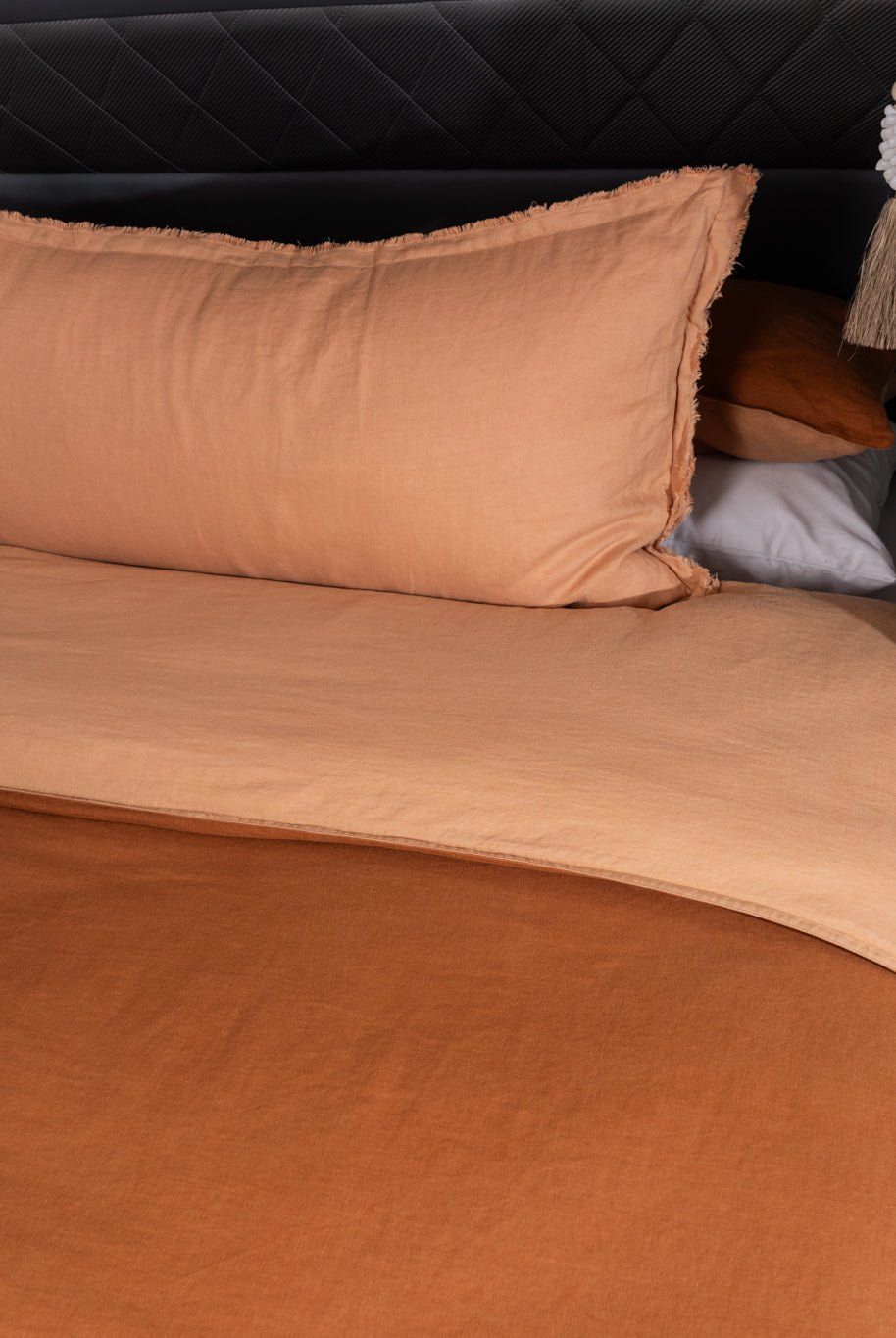 A burnt orange and peach quilt cover featured in a caravan
