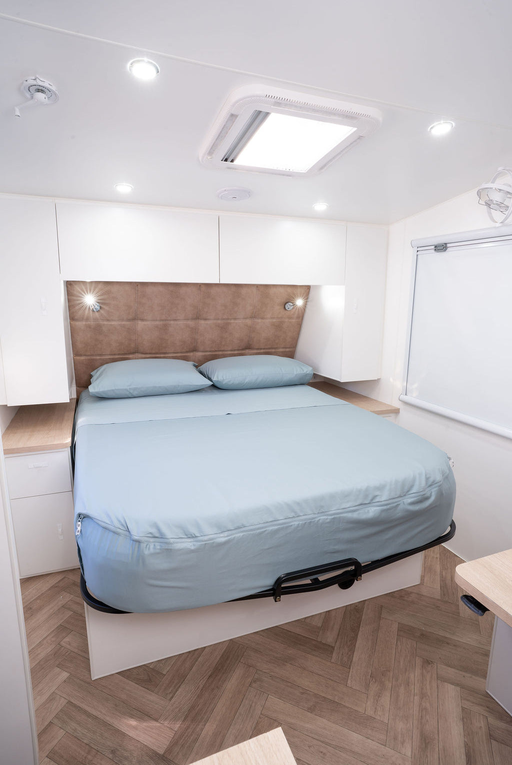 A caravan bed featuring Reef colourway