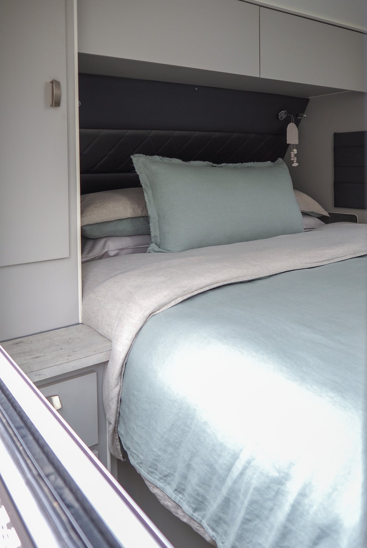 looking in the window of a caravan at the seaglass quilt cover