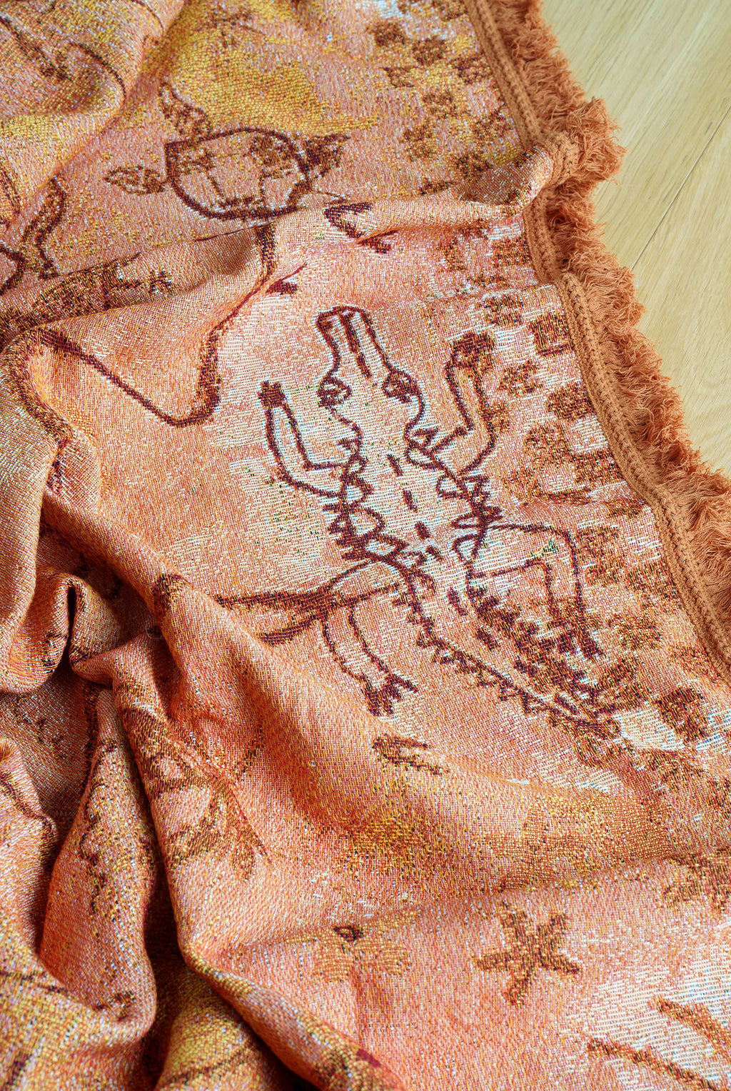 Crocodile detail on painted track throw