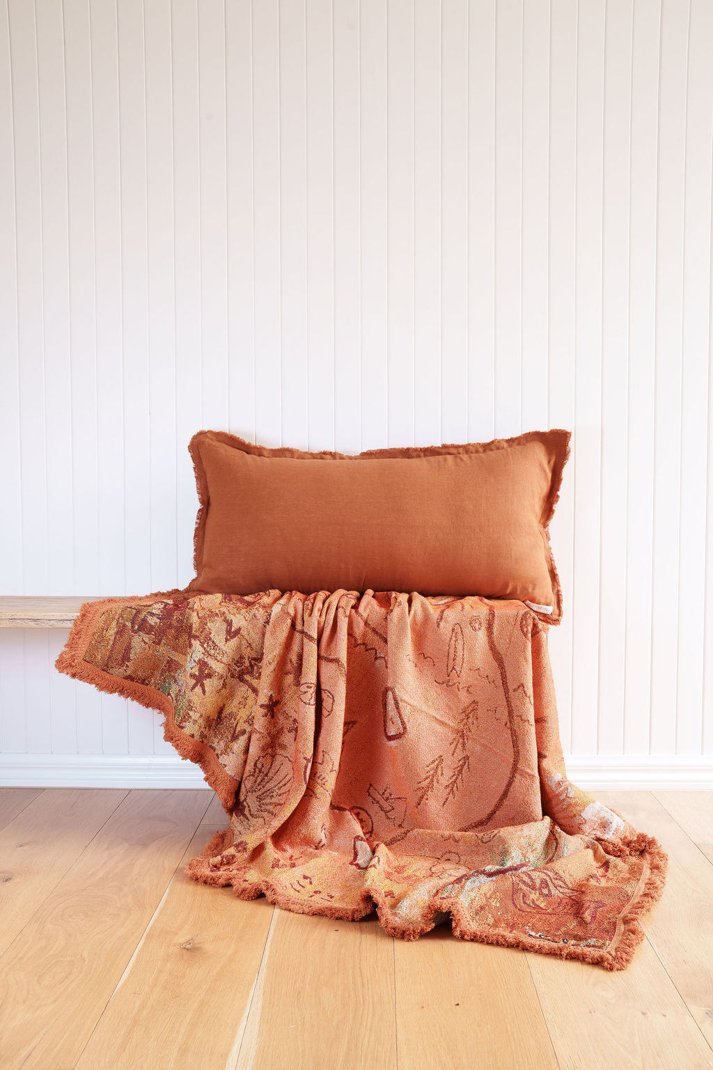 Painted track throw and Ochre Lumbar cushion styled on bench
