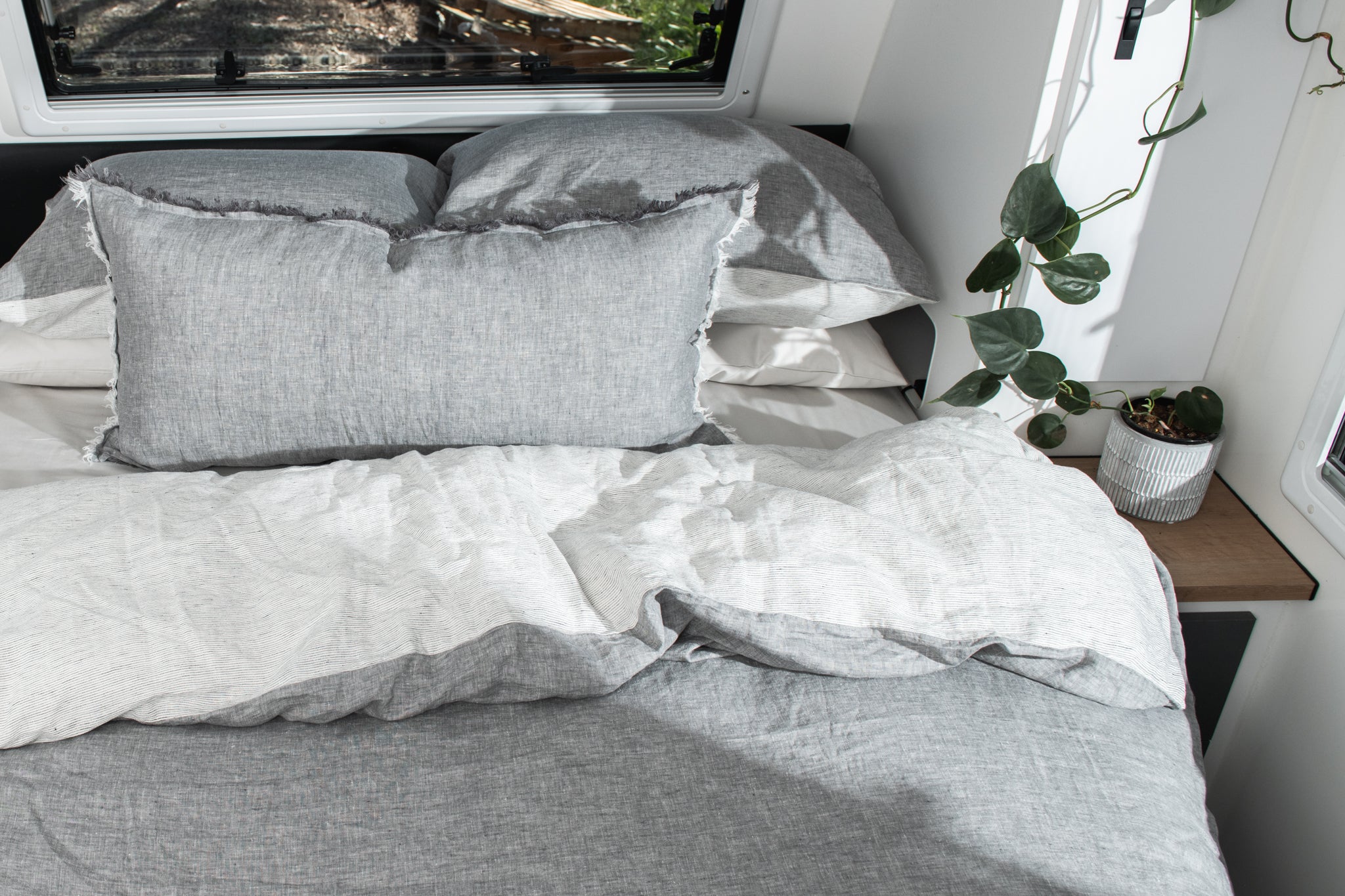 A caravan bed made up in Pier colourway