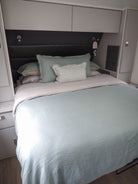 Caravan bed with Seaglass quilt cover and mini stripe cushion