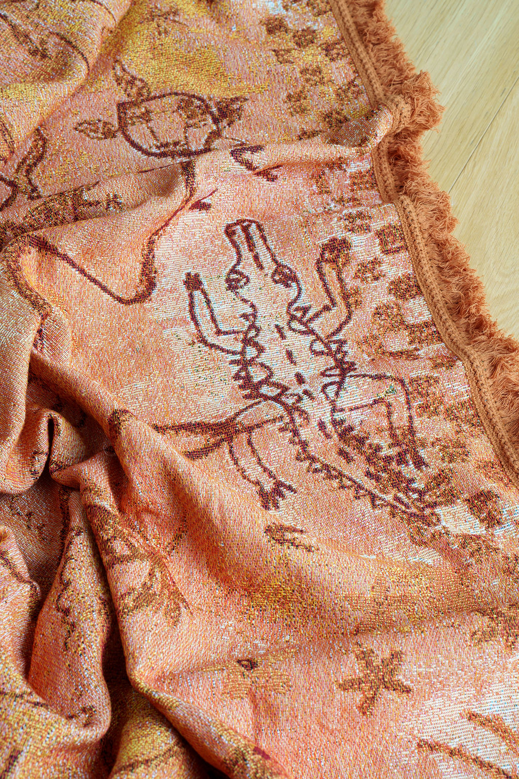 Crocodile detail on painted track throw