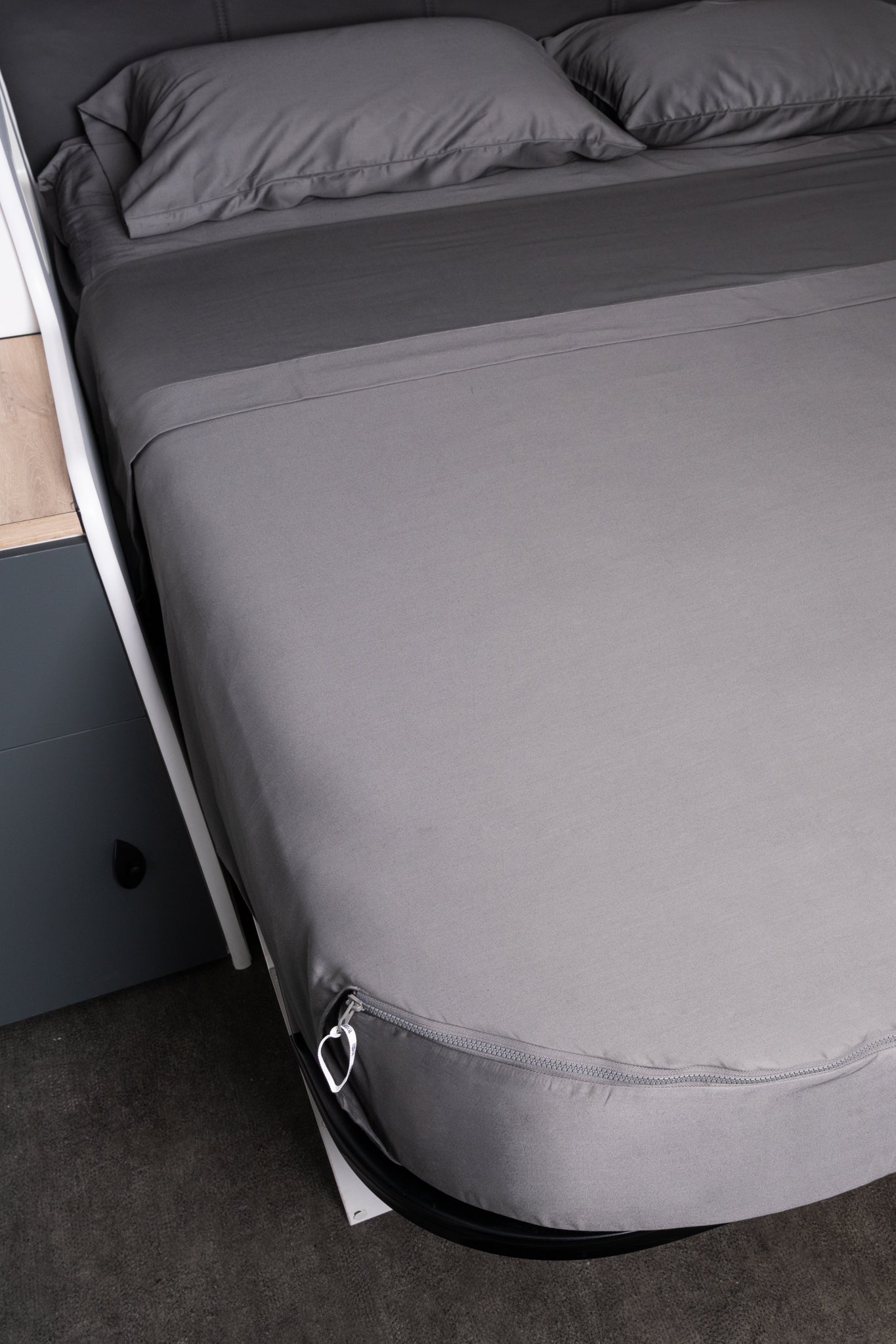 Close up of Sheet set in coal mine colourway in caravan